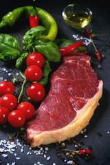 Raw steak with vegetables