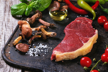 Raw steak with vegetables