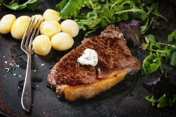 Grilled steak with potatoes
