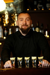 Bartender with tequila glasses