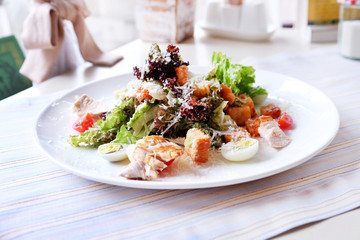 Caesar salad on table in cafe