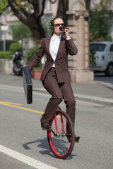 businesswoman with unicycle