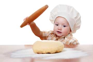 Cute kid rolls cook pizza dough. Isolated on white background
