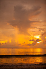 Silhouetted the beach at the sunset time.
