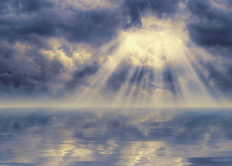 Obraz na płótnie Canvas Ray of sunlight breaks through stormy sky