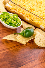 preparation of bean dip with jalapenos, sour cream and cheddar c
