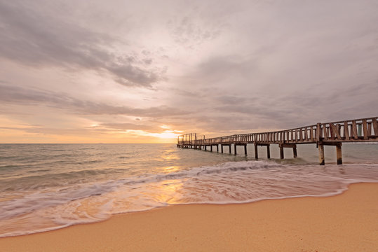 Wooden bridge  along sunrise sky