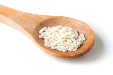 Sesame seeds in wooden spoon