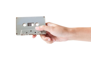 Hand holding cassette tape isolated