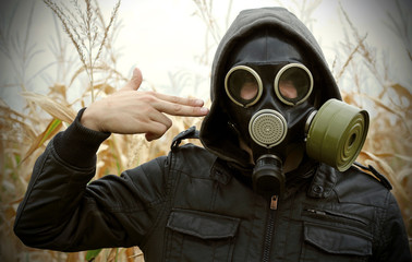 man gas mask gun danger of war