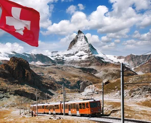 Rideaux velours Cervin Matterhorn peak with a train and flag of Switzerland in Swiss Alps