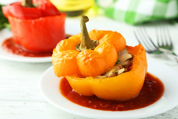 Red and yellow peppers stuffed with meat, rice and vegetables