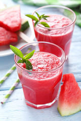 Fresh watermelon juice in the glass on wooden table