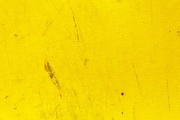 Old painted bright yellow plaster texture background