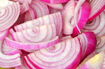Slised red onion, close up, as background  DOF
