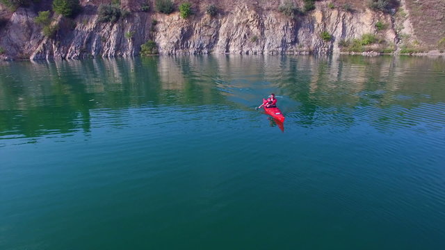 Aerial: athlete rowing in a kayak
