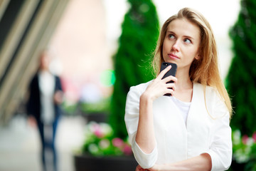 Beautiful casual woman with cell phone