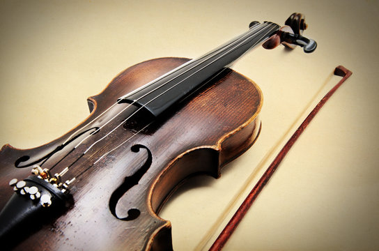 Classic violin on grunge paper texture.