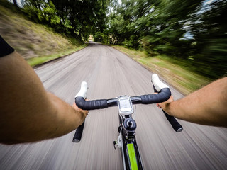 Going Down with Bicycle on the Road. pov, original point of view