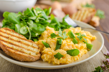 Scrambled eggs with salad