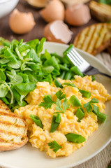 Scrambled eggs with salad