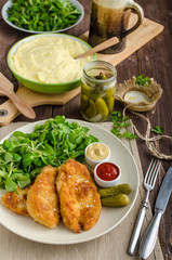 Schnitzel with mashed potatoes and salad