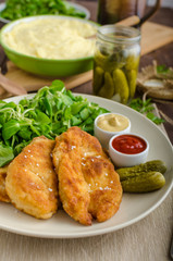 Schnitzel with mashed potatoes and salad