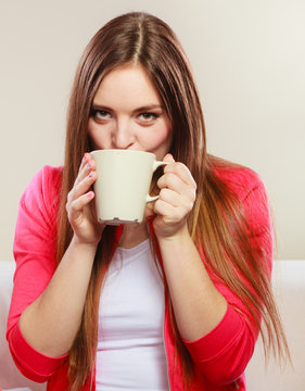 Woman drinking hot coffee beverage. Caffeine.