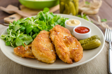 Schnitzel with mashed potatoes and salad