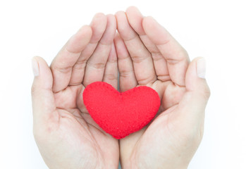 decorative red heart in human hands