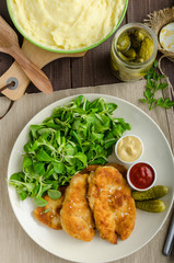 Schnitzel with mashed potatoes and salad