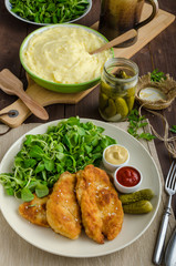Schnitzel with mashed potatoes and salad
