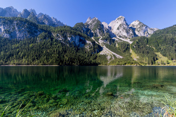 Naklejka na ściany i meble Beautiful landscape of mountains and lake on summertime, Gosausee lake, Alps, Austria, Europe.
