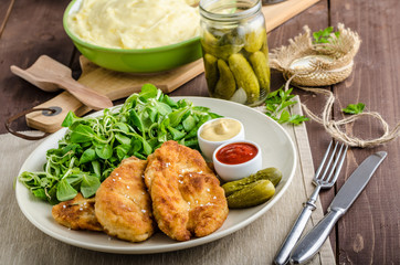 Schnitzel with mashed potatoes and salad