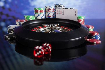 Poker Chips on a gaming with casino roulette