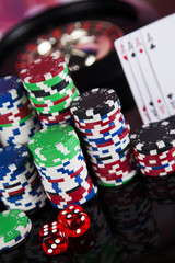 Poker Chips on a gaming with casino roulette