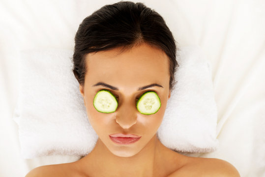 Woman Enjoying Spa, Having Cucumber On Eyes