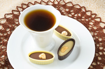 dark and white chocolate candies with hazelnut, cashew