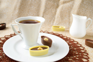 dark and white chocolate candies with hazelnut, cashew