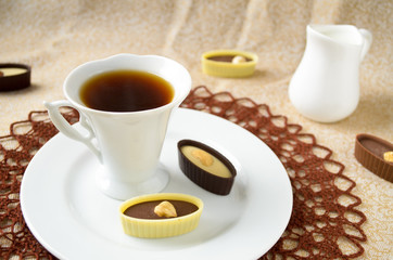 dark and white chocolate candies with hazelnut, cashew