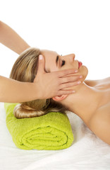 Obraz na płótnie Canvas Young woman has face massage.