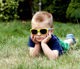 Little boy in sunglasses.