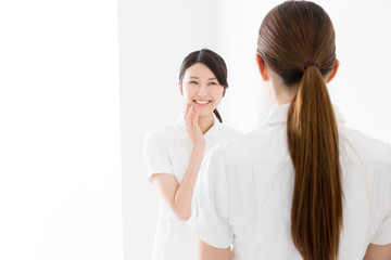 young asian nurse isolated on white background