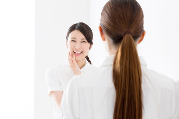 young asian nurse isolated on white background