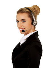 Happy young businesswoman with headset