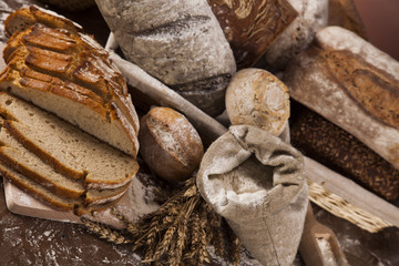 Freshly baked traditional bread on wooden table