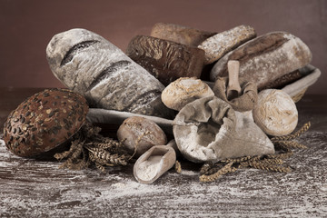 Freshly baked traditional bread on wooden table