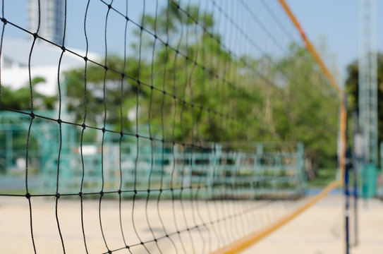 Volleyball Net In Outdoor Sport Court In Blurred Background.