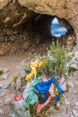 Colorful tourist's flags on mountain stone ridge
