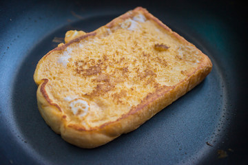 cooking for a french toast on frying pan